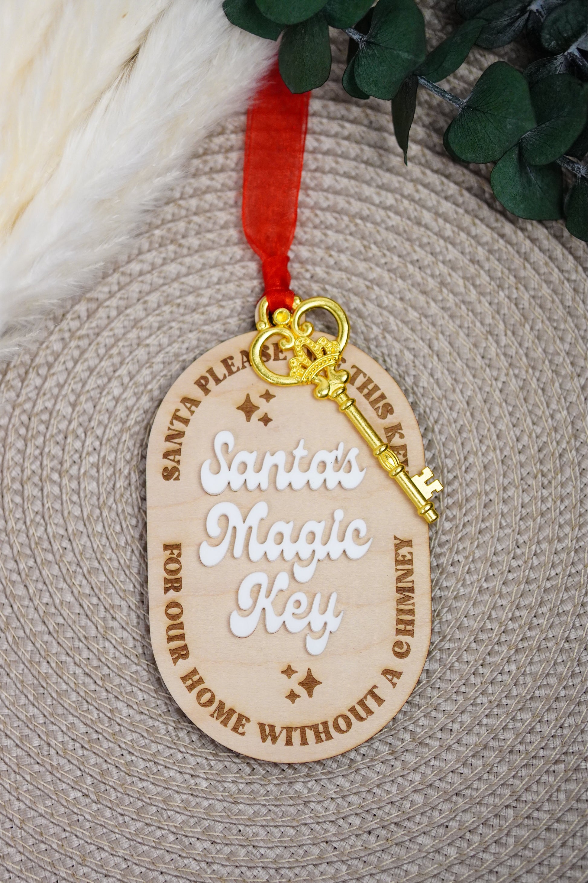Wooden key-shaped tag with text and a gold key on a textured surface.